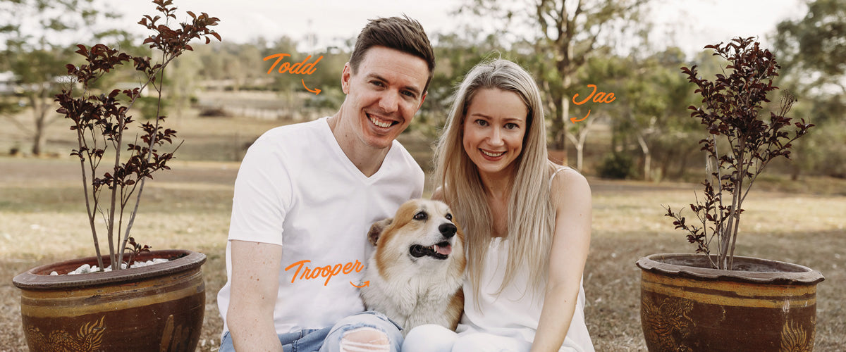 Todd Jacque and Trooper sitting on the steps in the backyard smiling