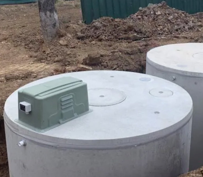 Septic System Tanks being installed in hole. Also great for grey water