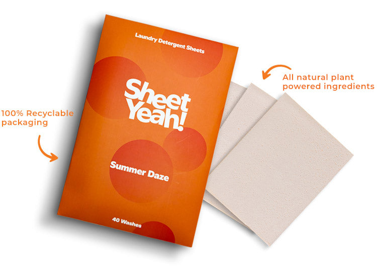 A single pack of Summer Daze Sheet Yeah! Laundry Detergent Sheets are laying on an white background with some white laundry sheets next to the pack with two callouts highlighting the 100% recyclable packaging and the all natural plant powered ingredients
