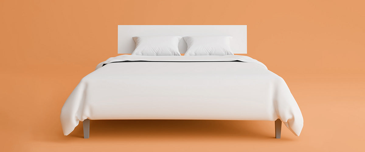 White bed on orange background